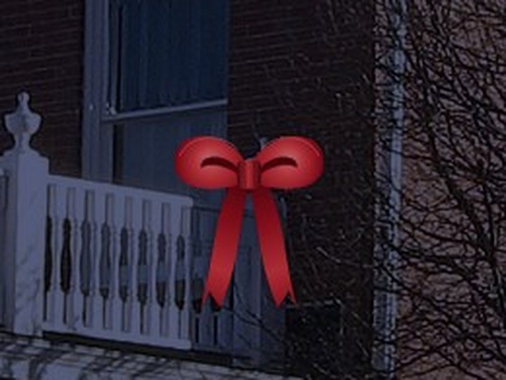 A red bow on a post.