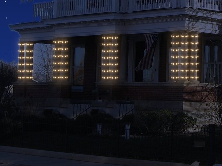 Porch columns wrapped in mini lights.