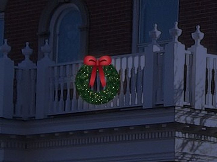 A lit wreath on the balcony.