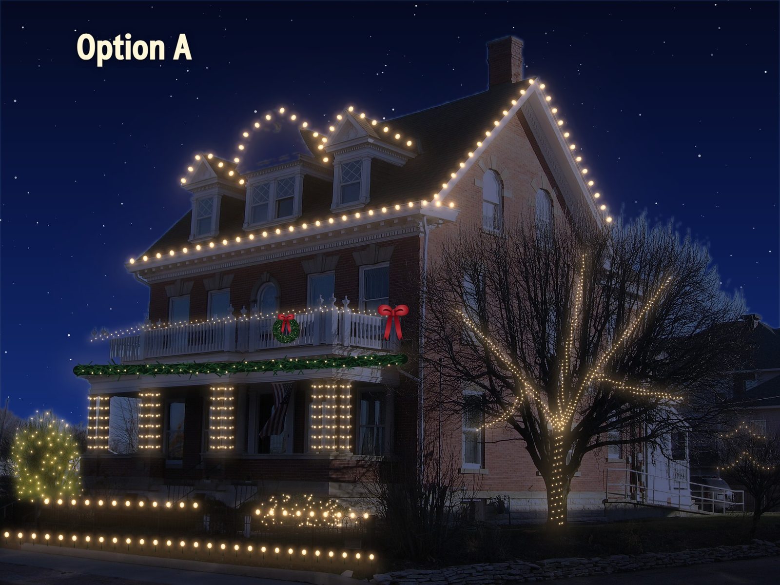 A brick house lit with every Rooflit tool: rooflines, wrapped columns, railing, garland, wreath, bow, a wrapped tree, shrubs, a C7 tree, fence and stake lights.